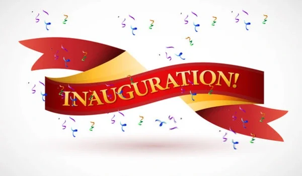 Red and gold ribbon banner reading Inauguration with falling confetti